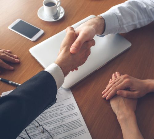 Young couple consultation with agent purchase rent property real estate handshake